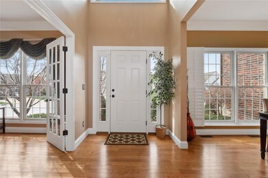 Spacious 2 story entry foyer opens to office & din