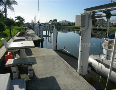 Waterfront/Dock/Pier - Concrete seawall, dock and boatlift. Approximately 47 ft. of waterfront and 25 minutes to Harbor.