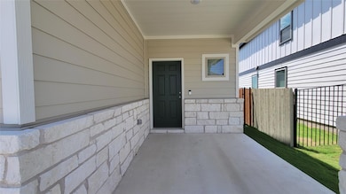 Property entrance featuring a patio area