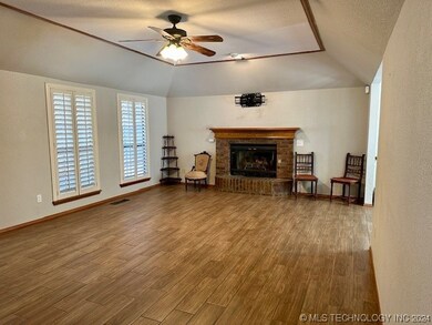 living with plantation shutters & fireplace