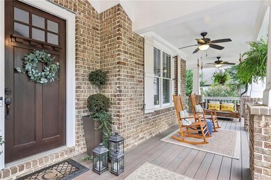 Wooden terrace featuring ceiling fan and covered p