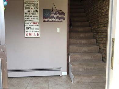 Front door entry foyer has ceramic flooring and st