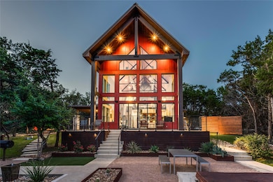 Back of property featuring a patio and stairs