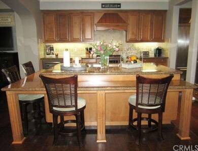The upgraded kitchen has granite countertops, tumb