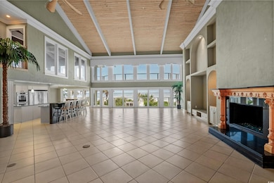 Unfurnished living room with light tile patterned 