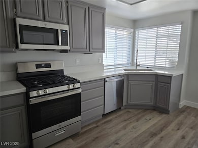 Kitchen with appliances with stainless steel finis