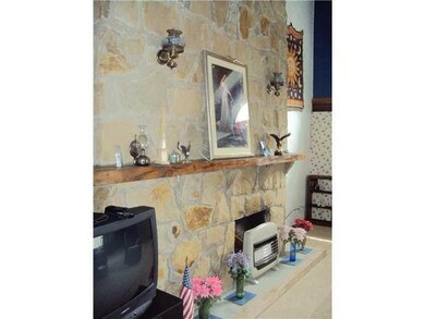 Family Room. Stone fireplace located in lower leve