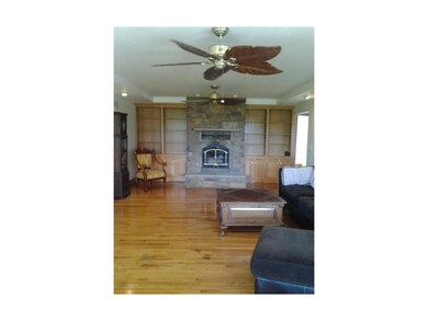 Large great room, wood floors, tons of shelving