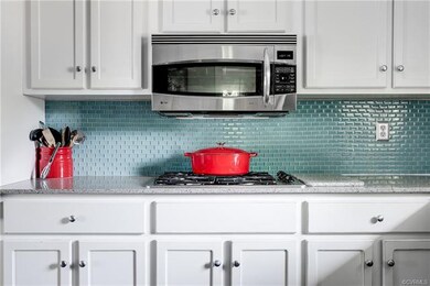 Detailed view of gas range with vented microwave m