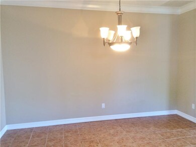 Dining Room. Tile floor with ample space for large
