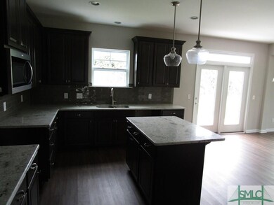 Kitchen Island with Granite Tops and Custom Lighti
