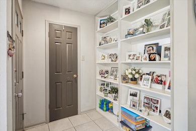 Entryway with thoughtful shelving and storage clos