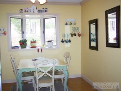 Dining: Sunny dining area with bay window.