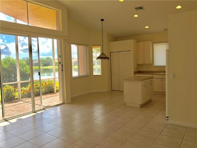 KITCHEN OPEN TO FAMILY ROOM WITH LAKE VIEW