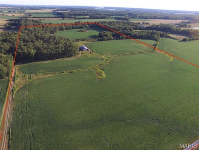 Aerial view of sparsely populated area with property boundaries highlighted