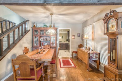 Formal Dining Room features hardwood floors and wi