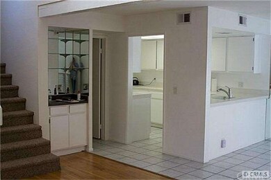 Wet bar adjacent to kitchen.
