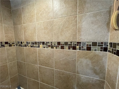 Bathroom view of a tile shower