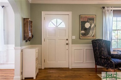 Welcoming entrance with original door boasting a h