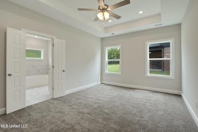 Photo is of a similar home,