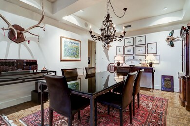[Dining Room]
Parquet floors extend from the foye