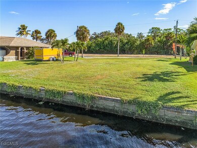 View of property's community featuring a water view and a lawn