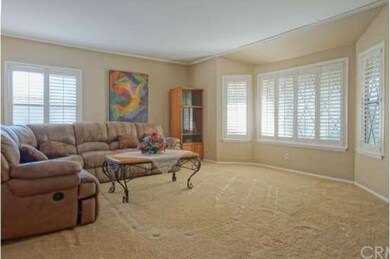 Massive living room has two tone paint, plantation