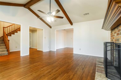 Unfurnished living room with visible vents, a bric