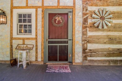 The red front door is an idyllic way to welcome yo
