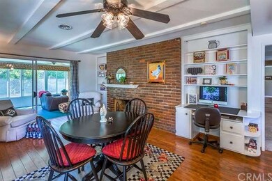 The family room also features a brick fireplace wi