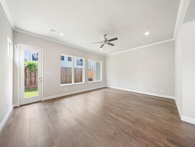 The living room is sapcious, with the large window