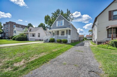 View of front of house featuring a front lawn and covered porch