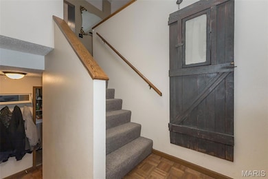 Stairs featuring baseboards