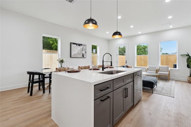 Discover seamless living in this thoughtfully designed home, where the kitchen and dining area seamlessly blend into the inviting living room. Whether you're hosting a dinner party or enjoying a quiet evening, the spacious layout provides the perfect backdrop for every occasion.