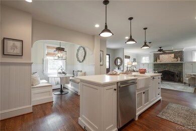 Kitchen with a fireplace, white cabinets, dishwash