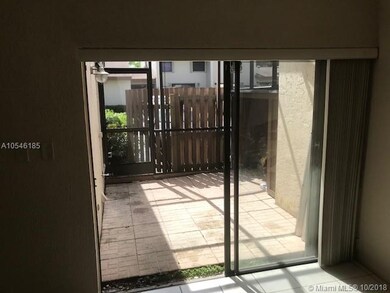 Screened patio opposite kitchen for pleasant outdo