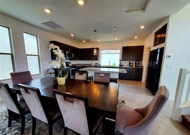 Dining room featuring light tile patterned floorin
