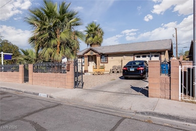 View of front of property with a gate, concrete dr