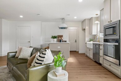 Living room with sink and light hardwood / wood-st