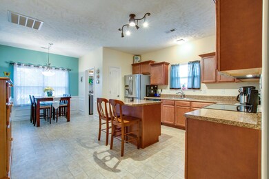 Fabulous kitchen with island, wainscoting, pantry & breakfast nook.
