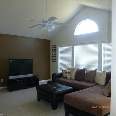 Vaulted ceilings in sunroom with wall of windows f