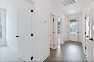Front hallway with 2 guest bedrooms, full guest ba