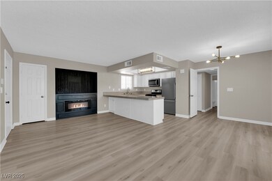 Unfurnished living room with light wood finished f