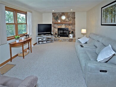 Lovely family room with Stone gas fireplace.