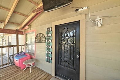 View of exterior entry with a sunroom