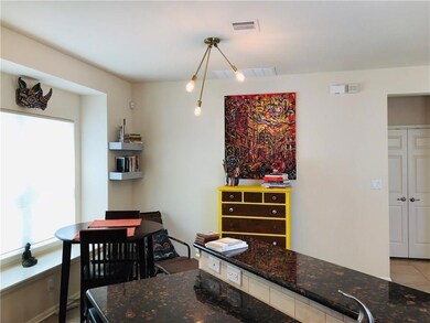 Dining space with visible vents and tile patterne