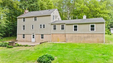 Walk-out basement with awesome patio, brownstone bench and fire pit
