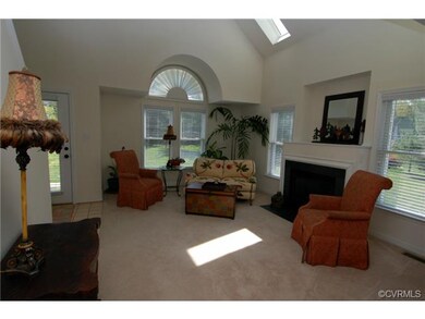 View of the living room with cathedral ceiling and