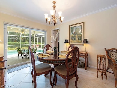 The formal dining area overlooks the screened pool