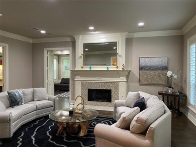 Formal living area with fireplace.  Plantation shu